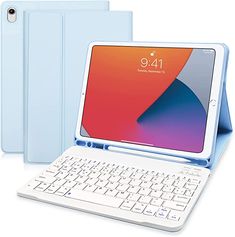 an ipad keyboard and tablet case sitting next to each other