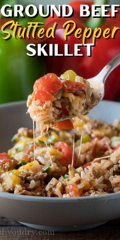 a spoon full of ground beef and tomato stuffed pepper skillet with text overlay