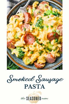 the cover of smoked sausage pasta with broccoli and cheese on it, in a bowl