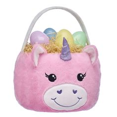 a pink unicorn purse with eggs in it