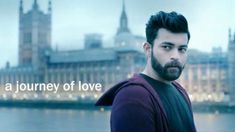 a man with a beard standing in front of a cityscape and the words a journey of love