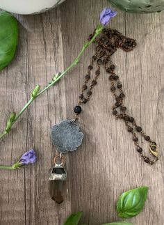 This is a vintage Victorian style pendant that has been up cycled. It has a pretty smokey quartz attached and all of it was hand made by me, the hand beaded necklace compliments the over all feel of this pretty necklace. Bohemian Smoky Quartz Jewelry Gift, Handmade Spiritual Smoky Quartz Jewelry, Bohemian Brown Necklace With Large Pendant, Rustic Brown Healing Necklace, Brown Pendant Beaded Necklaces, Unique Brown Pendant Beaded Necklace, Brown Beaded Pendant Necklace, Unique Handmade Brown Crystal Necklace, Unique Brown Beaded Pendant Necklace