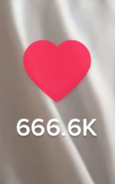 a red heart sitting on top of a white sheet with the text 666 6k