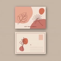 two business cards with flowers and leaves on them