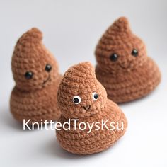 three small crocheted stuffed animals sitting next to each other