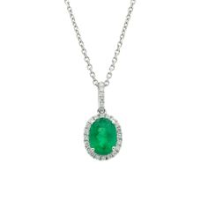 Adorn Yourself With The Breathtaking Beauty Of Our Oval-Cut Emerald Necklace In 18k White Gold. This Enchanting Piece Showcases An Exquisite Oval-Cut Emerald Boasting A Captivating Green Hue That Will Surely Mesmerize. With A Length Of 16 Inches, This Necklace Elegantly Graces Your Neckline, Offering A Delicate And Feminine Touch. The Oval-Cut Emerald Takes Center Stage, Surrounded By A Halo Of Round Diamonds, Adding A Radiant Sparkle To The Already Stunning Gemstone. The Diamonds In This Neckla White Gold Diamond Emerald Necklace With Hallmark, Classic White Gold Emerald Necklace With Diamond Accents, Platinum Gemstone Necklace In Fine Jewelry Style, Exquisite White Gold Emerald Necklace With Diamond Cut, Classic Platinum Necklace With Gemstone, Classic Emerald And Diamond Necklace, Classic Hallmarked Emerald Necklace With Diamonds, Classic Platinum Gemstone Necklace, Classic Hallmarked Emerald And Diamond Necklace