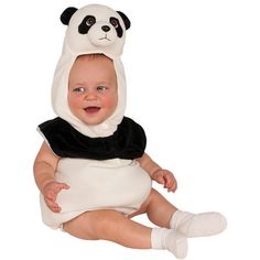 a baby in a panda costume sitting on the ground