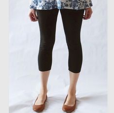 Womens cropped cotton leggings.  A wardrobe staple. They are perfect for wearing under tunics, skirts and dresses!  Made of soft 4 way stretch cotton lycra, these leggings have a 3.5" fold over high waist waistband, which you can wear up for tummy support or fold down to wear at your hip. The soft cotton lycra waistband allows for easy pull on style.  All seams are serged and reinforced at the crotch, and hemmed.  Cropped length hits about mid calf.  Inseam =  23.5" *Length can be lengthened or shortened as you'd like  (for reference I'm 5'5" modeling a size Medium) See Swatch Chart in the last photo for other Color options. Garments are Made To Order Please allow 7-10 days for your item to be sewn Below are my standard size measurements, which are simply a guideline, if you would like to Casual Fitted Mid-thigh Leggings, Fitted Mid-thigh Casual Leggings, Casual Knee-length Capris For Fall, Fall Cropped Leg Capris With Elastic Waistband, Black Relaxed Fit Capris, Versatile Relaxed Fit Yoga Pants For Spring, Relaxed Fit Cotton Knee-length Capris, Casual Knee-length Stretch Leggings, Versatile Black Capris For Spring