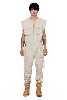 JONNY COTA SLEEVELESS CANVAS JUMPSUIT IN BONE Camo Jumpsuit Outfit, Jumpsuit Outfit Men, Agender Outfits, Jumpsuit Man, Man Jumpsuit, Mechanic Fashion, Canvas Jumpsuit, Men Overall, Camo Jumpsuit