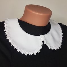 a black and white dress with lace collar