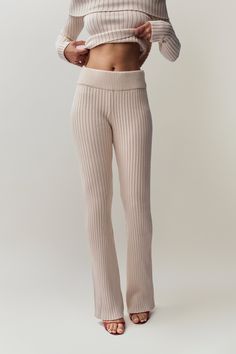 Elevate your everyday outfit with our newest addition, the Thalia Rib Knit Pant featuring a thick banded waist. Perfectly crafted for those who value style and comfort, these versatile pants are the ideal choice for both lounging at home and stepping out in chic fashion. Fabrication: Fine Short Hair Mink Yarn; 72% Viscose, 28% Poly Sonali is wearing a size S and is 5'10" with a 31" bust, 35" hips, and 23" waist Fine Short Hair, Versatile Pants, Off Shoulder Sweater, Everyday Outfit, Stepping Out, Chic Fashion, Knit Pants, Shoulder Sweater, Everyday Outfits