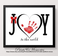 a card with the word joy to the world written in red ink and a handprinted heart