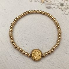 This classic piece is a jewelry lover's must have! Sure to become your new favorite everyday staple. 3mm quality gold fill beads strung on super strong stretch cord. 11mm double sided St Benedict coin charm. Perfect for creating layered looks or wear one alone. Dating back over 1,000 years, the Benedictine cross is one of the most powerful symbols of divine protection in the Christian world. Carry this cross with you at all times as a symbol of protection over you, your loved ones and all of you Powerful Symbols, Divine Protection, Christian World, St Benedict, Silver Stacking Rings, Rose Gold Chain, Disc Necklace, Bracelet Gold, Birthstone Necklace