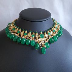 Stunning pachi kundan and natural stone necklace set in forest green and gold. Stones are set in silver foil and 18kt gold plated. Green Emerald Kundan Necklace As A Gift, Green Emerald Kundan Necklace For Gift, Green Kundan Emerald Necklace For Gift, Kundan Emerald Necklace As Gift, Kundan Emerald Gemstone Necklace As A Gift, Gift Kundan Emerald Necklace, Gift Emerald Kundan Necklace, Green Kundan Necklace With Gemstone, Emerald Kundan Necklace For Gifting