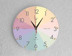 a multicolored clock with numbers on the face