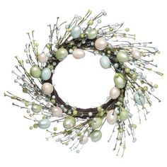 a wreath with white and green ornaments on it