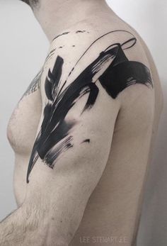 a man with black ink on his arm