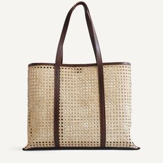 A rattan and leather tote in warm, neutral tones.. The Margot is the go anywhere, carry everything bag for summer and beyond. With a leather base that can handle the weight of your extra large Perrier, and leather shoulder straps that feel soft as butter on sun-kissed shoulders. In a stylish oversized shape perfect for Luxury Handwoven Rectangular Beach Bag, Luxury Leather Shoulder Bag For Beach, Leather Handles Tote Beach Bag, Luxury Leather Straw Bag For Shopping, Luxury Leather Handle Tote Beach Bag, Luxury Leather-handled Tote Beach Bag, Luxury Summer Bag With Bamboo Handle, Luxury Summer Bags With Bamboo Handle, Luxury Beach Hobo Bag With Top Handle