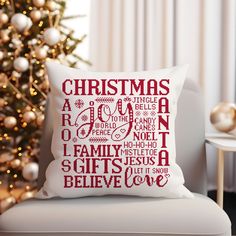 a christmas pillow sitting on top of a white chair