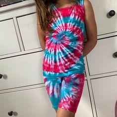 Tie Dye Sets are perfect for any time of year, especially summer! This set includes a tank or short sleeve t-shirt and a pair of biker shorts. These are so cute and every little girl needs a set in her life. Tie-Dye makes everyone happy :) Why not put smiles on all the little girls in your life! Made to Order - There may be slight variations in design. Dyes used will ensure your clothing stays bright & colorful for years to come. T-Shirts and Tanks are 100% cotton. Unisex Sizing. Shorts are Sleeveless Summer Short Set, Multicolor Tank Top For Summer Loungewear, Multicolor Casual Tank Top For Loungewear, Casual Multicolor Tank Top For Loungewear, Sleeveless Summer Short Set For Beach, Sleeveless Summer Beach Short Set, Summer Tie Dye Shorts For Loungewear, Casual Multicolor Short Set For Summer, Casual Multicolor Cotton Short Set