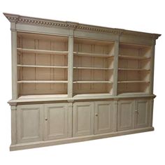 a white bookcase with two doors and shelves