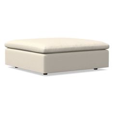 a white footstool sitting on top of a white floor