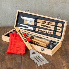 a wooden box filled with utensils and cooking utensils on top of a table