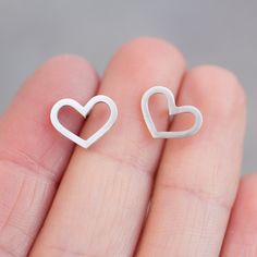 "These heart earrings are a special piece for a romantic nature and a great gift for her on a special occasion. They are great for everyday use and so lightweight, that you'll never feel them. The earrings are approx. 10 mm (3/8\") high. Choose material for the earrings (sterling silver or 9k gold). The earrings are made to order, so it'll take up to 5 days to ship them. You will receive them gift wrapped for no additional charge." Minimalist Nickel-free Heart Pendant Jewelry, Minimalist Nickel-free Heart-shaped Jewelry, Minimalist Heart-shaped Nickel-free Jewelry, Minimalist Heart Shaped Nickel-free Jewelry, Minimalist Nickel-free Heart Jewelry, Dainty Hypoallergenic Heart Cut Jewelry, Dainty Heart Cut Hypoallergenic Jewelry, Minimalist Hypoallergenic Heart Pendant Jewelry, Minimalist Hypoallergenic Heart-shaped Jewelry