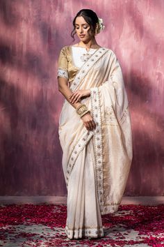 Off-white saree with thread, gota embroidery in floral pattern on border.
Components: 1
Pattern: Embroidery
Type Of Work: Thread, gota
Fabric: Chanderi
Color: Off White
Other Details: 
Note: Saree blouse worn by the model is not for sale
Occasion: Wedding - Aza Fashions Baluchari Saree, Gota Embroidery, Off White Saree, Saree Women, Dhakai Jamdani Saree, Chanderi Sarees, Weave Shop, Chanderi Saree, Chanderi Silk Saree