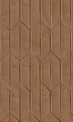 a close up view of a wall made out of brown colored paper with wavy lines on it