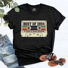 the best of 1953 75 years of being awesome t - shirt is on display next to some sandals