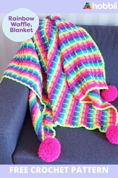 a crocheted blanket with pom - poms on it and the text rainbow waffle blanket free crochet pattern