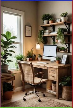 a desk with a computer and potted plants on it in front of a window