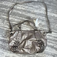 Nwt Nine West The Convertible Handbag Zipper Closure Really Pretty Metallic Color-Silvery/Taupe Color Markings On The Bag As Indicated In The Photos Versatile Tote Bag With Silver-tone Hardware, Versatile Tote Shoulder Bag With Silver-tone Hardware, Silver Bags With Detachable Strap For On-the-go, Silver Tote Shoulder Bag For On-the-go, Silver Hobo Bag With Silver-tone Hardware Tote, Silver Tote Shoulder Bag With Detachable Strap, Silver Hobo Bag With Silver-tone Hardware, Silver Shoulder Bag With Removable Pouch And Double Handle, Silver Crossbody Hobo Bag For Daily Use