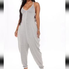 Heather Gray Colored Vneck Spaghetti Straps Racerback Super Stretchy Jumpsuit. Center Seam Stitching. Size Medium 95% Rayon 5% Spandex Casual Solid Color Backless Bodysuit, Summer Loungewear Backless Bodysuit, Backless Bodysuit For Summer Loungewear, Summer Backless Bodysuit For Loungewear, Casual Bodysuit With Built-in Bra For Night Out, Trendy V-neck Bodysuit For Loungewear, Casual Cami Bodysuit For Beach, Solid Color V-neck Bodysuit For Loungewear, Casual Backless Spring Bodysuit