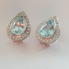 Metals Type: Hallmarked 18K Gold Weight: 11.70 grams Diamond weight 1.40ct Fit: Modern fit Color: H Clarity: VSI1 Stones: Aquamarines 16ct Condition: Excellent Stunning aquamarine diamond earrings crafted in 18k gold. Breathtaking, high quality, icy blue aquamarines totaling 16 ct. Diamonds are H color and VSI1 clarity. The earrings weigh 11.70 grams and are really safe to wear thanks to high quality, well thought out clasps. These earrings make a great gift for. to anyone who loves bold yet ele Formal Pear-shaped Clip-on Earrings, Vintage Pear-shaped Formal Earrings, Vintage Pear-shaped Earrings For Formal Occasions, Long Statement Earrings, Icy Blue, Aqua Marine, Earring Crafts, Aquamarine Blue, Modern Fit