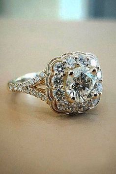 a close up of a diamond ring on a table