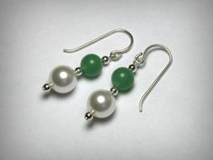 Simple & elegant pair of earrings, featuring green, genuine aventurine stone beads, and Swarovski faux pearls, in solid sterling silver. The pearls measure, 8mm, the aventurine beads ar 6mm. Sterling silver french wire drops. Ships in 2 to 3 business days. Elegant Aventurine Dangle Earrings, Green Aventurine Drop Earrings, Elegant Green Hypoallergenic Beaded Earrings, Jade Pearl Drop Earrings As Gift, Elegant Jade Beaded Earrings With Round Beads, Elegant Jade Beaded Round Earrings, Elegant Green Jade Beaded Earrings, Drop Earrings Pearl, Diamond Nose Stud