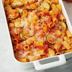 a casserole dish filled with pasta and vegetables