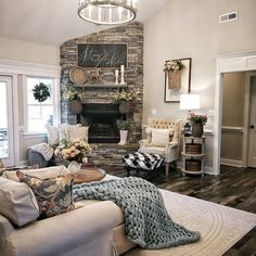 a living room filled with furniture and a fire place