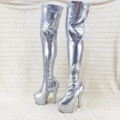 7" (178mm) Heel, 2 3/4" (70mm) Platform Stretch Thigh High Boot 1/2 Length Inside Zip Closure Color: Stretch Silver Hologram Us Woman's Sizes 5-14 (Ny Warehouse) New In Box Fitted Silver Glamorous Knee-high Boots, Glamorous Fitted Silver Heeled Boots, Silver Fitted High Heel Boots, Fitted Silver Heeled Boots For Night Out, Silver High Heel Boots For Night Out, Silver Boots For Club, Silver Fitted Knee-high Boots, Silver Fitted Platform Heels, Fitted Silver Platform Heels