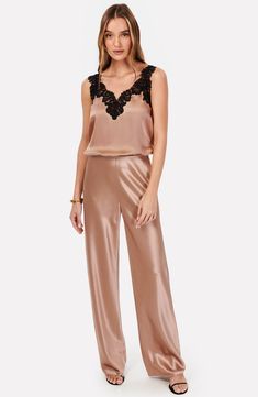 Fall for the sleek silhouette of these night-out pants designed with a high waist and crafted from glossy satin. 31" inseam; 21 1/2" leg opening; 11 1/2" front rise (size Small) Unlined 73% acetate, 27% polyester Dry clean Imported Elegant Silk Bottoms For Date Night, Sleek Silk Party Bottoms, Chic Silk Pants For Night Out, Satin Straight Pants For Night Out, Straight Satin Pants For Night Out, Sleek Silk Pants For Evening Wear, Sleek Silk Pants For Evening, Sleek Satin Pants For Evening, Sleek Silk Party Pants