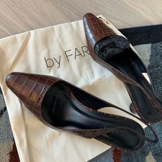 Crafted In Chocolatey, Croc-Embossed Calfskin, These Diana Slingbacks From By Far Add Class To Any Look. With A Pointed Toe, Square-Cut Vamp And An Angular, Conical Heel, These Are Versatile, Stylish Pumps You'll Want To Wear All Day. 100% Italian Soft Leather Insole 100% Luxurious And Extremely Soft Italian Polished Goatling Leather Heel Measures About 7cm / 2.95 Inches. There Is A Matching By Far Bag In My Profile. Chic Leather Slingback Pumps With 4-inch Heel, Office Calf Leather Slingback Pumps With Almond Toe, Leather High Heel Slingback Pumps For Work, Designer Leather High Heel Slingback Pumps, Leather Slingback Pumps With 4-inch Heel For Office, Leather Slingback Pumps With Pointed Toe, Chic Leather Slingback Pumps With Round Toe, Brown Closed Toe Slingback Pumps For Work, Leather Medium Width Slingback Pumps For Party