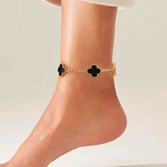 Step into a world of charm and enchantment with the Clovers Anklet. The intricately designed clover charms, delicately suspended on a sleek chain, create a mesmerizing piece that adds a touch of whimsical beauty to your ankle. Embrace the magical allure of the clover symbol and let it accompany you on your journey to success and happiness. Now available in black and white. Elegant Metal Anklets As Gift, Elegant Metal Anklets For Gift, Elegant Metal Anklets Gift, Chic Adjustable Chain Anklet For Gift, Chic Adjustable Anklets As A Gift, Clover Symbol, Success And Happiness, Clover Charm, Beautiful Handbags