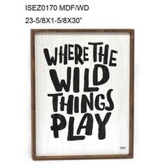 a sign that says where the wild things play in black ink on white paper with wood frame