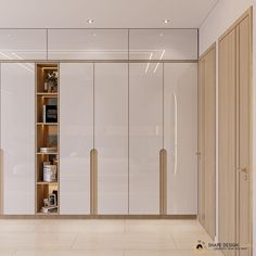 an empty room with white closets and wooden shelves on the wall, in front of a large mirror