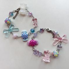 Cotton candy corner ( pink & blue)  Nerds ( purple & pink) Pink Whimsical Charm Bracelet For Gift, Handmade Pink Kawaii Charm Bracelet, Fun Pink Charm Bracelet, Playful Pink Charm Bracelet For Gift, Playful Pink Charm Bracelet As Gift, Colorful Playful Bracelets For Party, Colorful Playful Party Bracelets, Fun Blue Bracelets For Gifts, Playful Colorful Bracelets For Party