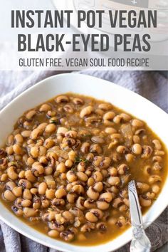 instant pot vegan black - eyed peas in a white bowl with a spoon on the side