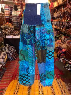 Our harem pants are one size the scrunch top Allows these pants to comfortably fit a range of sizes these pants can fit small to xxl  Measurements  Waist 24-44. Inches  The scrunch waist allows these pants to ft a range of sizes Length 39 inches  From top of pants to bottom  Inseam 27 inches Bohemian Patchwork Harem Pants, Bohemian Turquoise Bottoms For Vacation, Summer Green Harem Pants With Elastic Waistband, Green Cotton Harem Pants For Vacation, Bohemian Harem Pants With Pockets For Vacation, Green Harem Pants For Vacation, Bohemian Harem Pants For The Beach, Summer Hippie Patchwork Pants, Hippie Summer Patchwork Pants