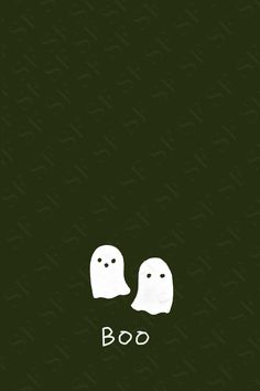 two white ghost faces with the word boo on it's back and bottom corner